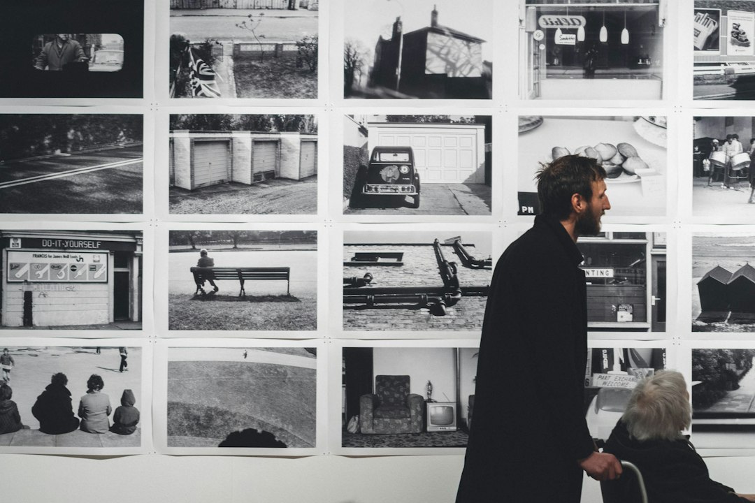 Arts professionals viewing an exhibition in a gallery