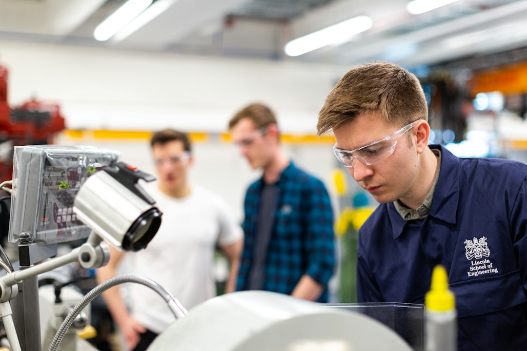Engineering maintenance technician working with industrial machinery